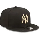 schwarze-snapback-cap-mit-flachem-schirm-und-beigem-logo-9fifty-league-essential-der-new-york-yankees-mlb-von-new-era