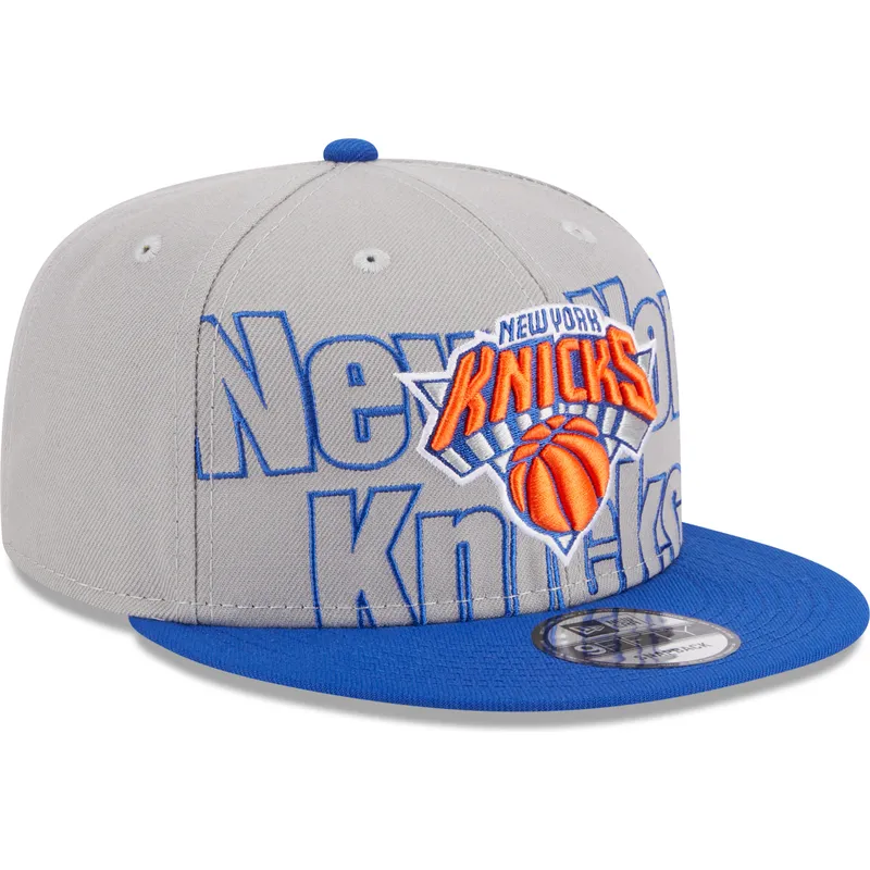 graue-und-blaue-flatcap-snapback-9fifty-draft-edition-2023-der-new-york-knicks-nba-von-new-era