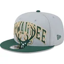 graue-und-grune-snapback-kappe-9fifty-tip-off-2023-der-milwaukee-bucks-nba-von-new-era
