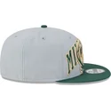 graue-und-grune-snapback-kappe-9fifty-tip-off-2023-der-milwaukee-bucks-nba-von-new-era